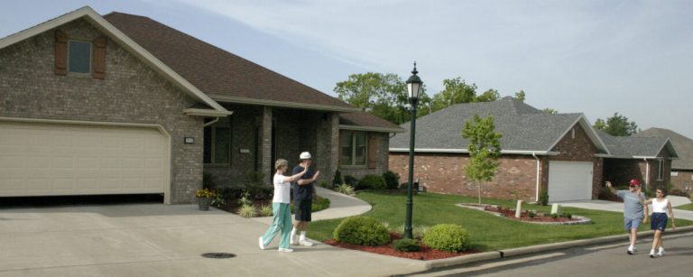 Marantha Village neighbors greeting each other in the senior community neighborhood