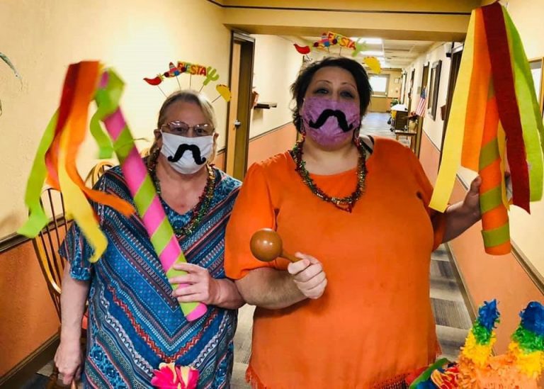 2 maranatha village residents dressed up for a party